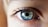 person opening his right eye with blue iris