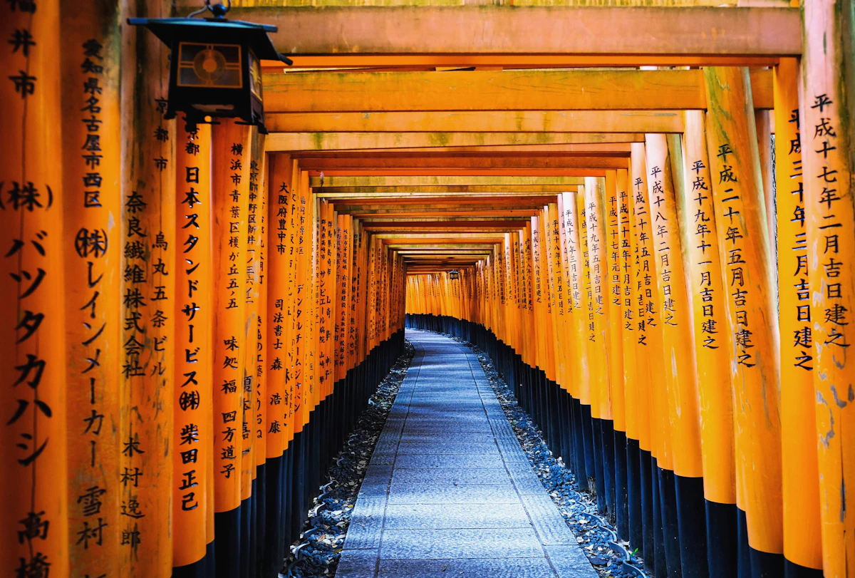 Rows of orange torii gates at Fushimi Inari, Kyoto