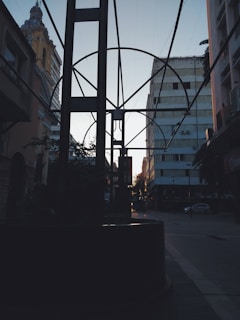 A sleek cinematic frame showing a minimalist urban landscape at dusk with soft natural lighting.