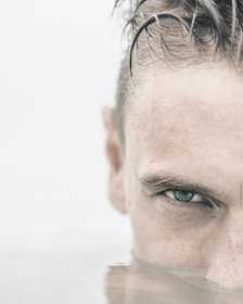 Close-up of a swimmer's focused face during an advanced training session.