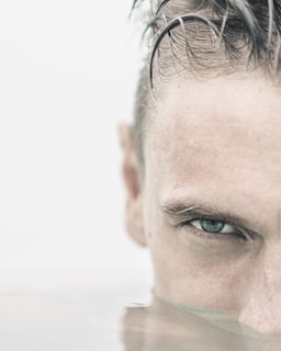 Close-up of a swimmer's focused face during an advanced training session.