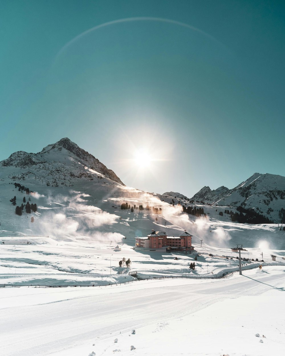 brown building on snow field during daytime