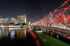 red metal bridge at night