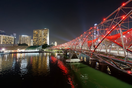 red metal bridge at night