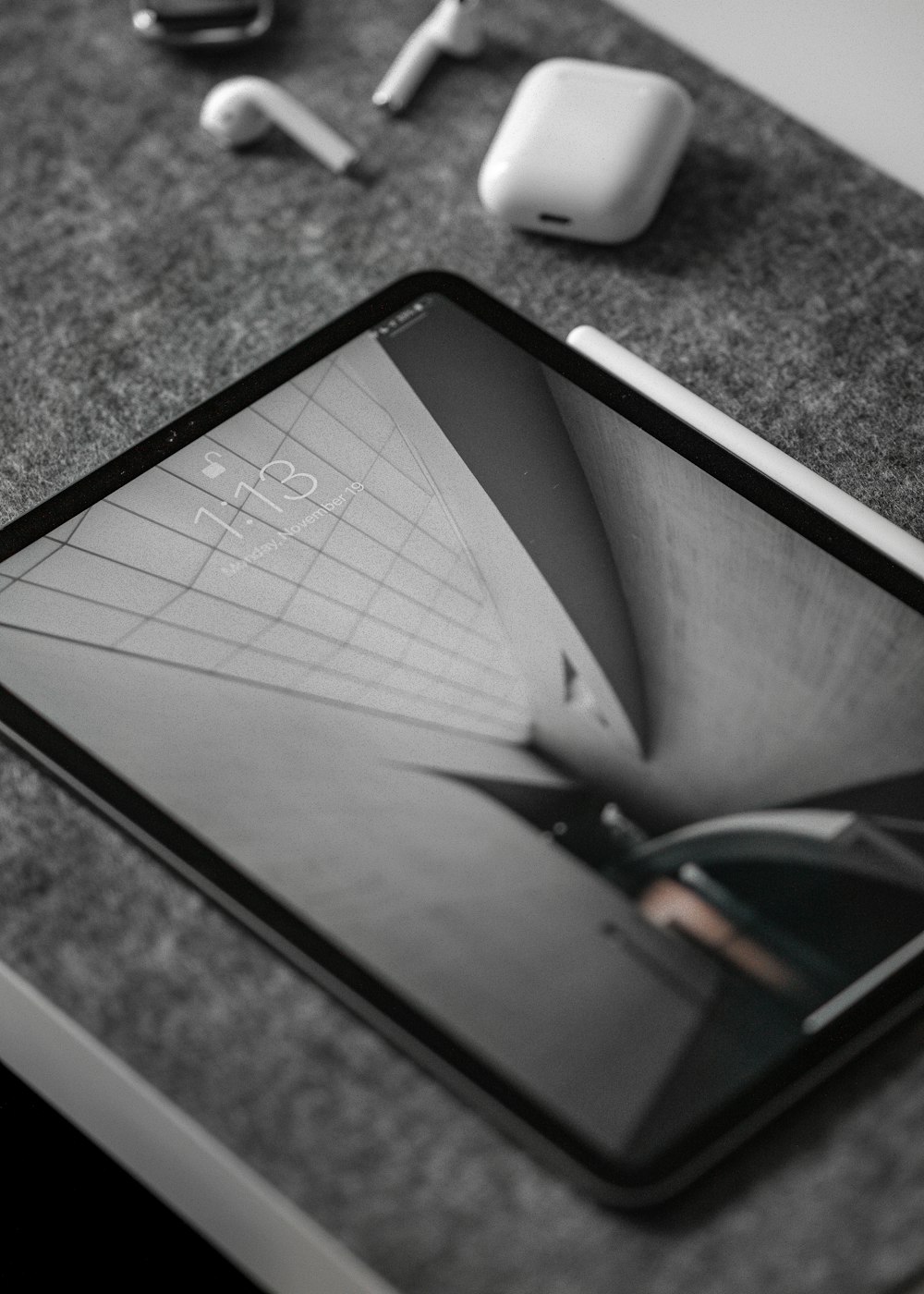 black iPad on gray surface