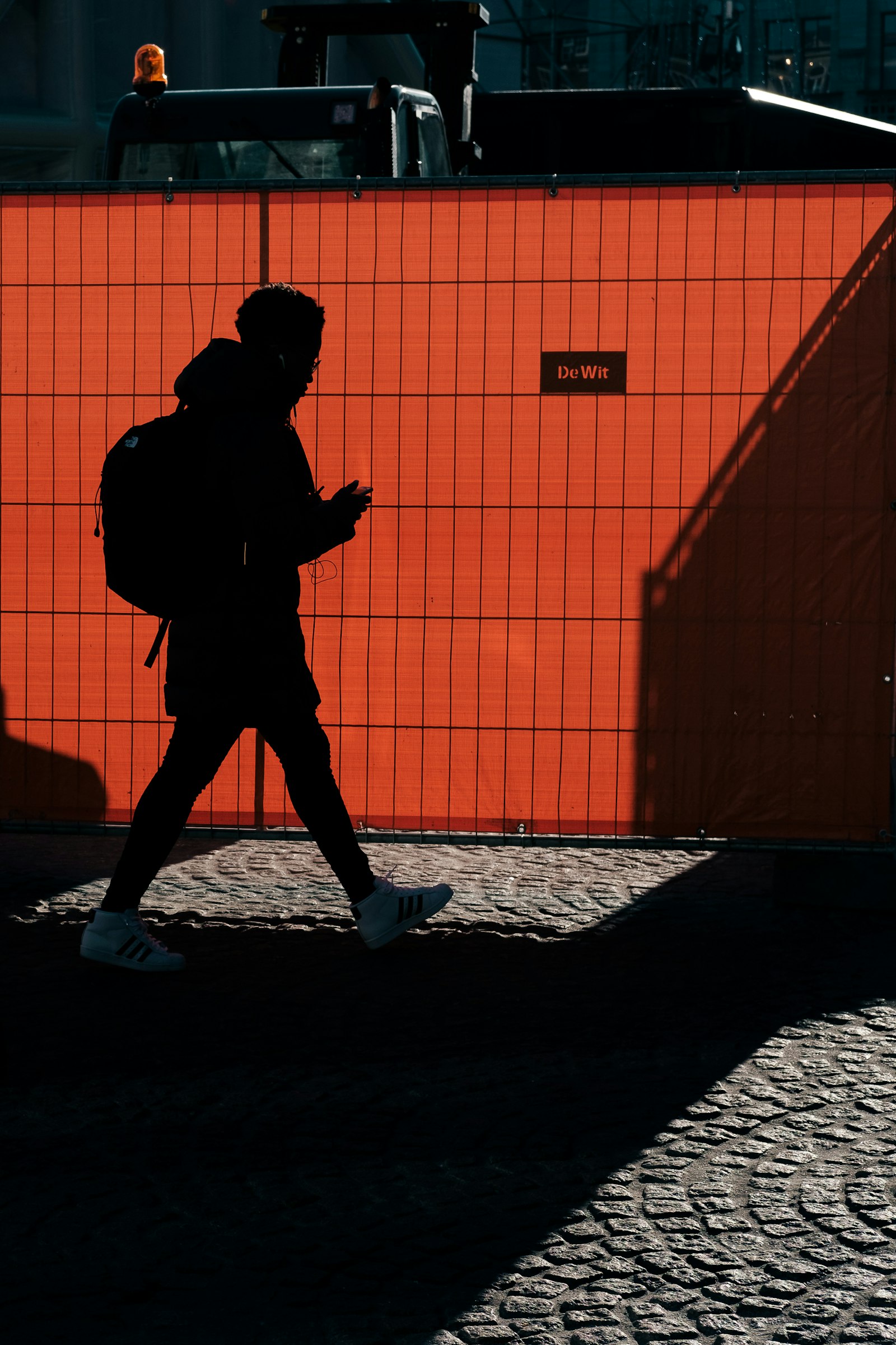 Fujifilm X-E3 + Fujifilm XF 35mm F2 R WR sample photo. Person walking on gray photography