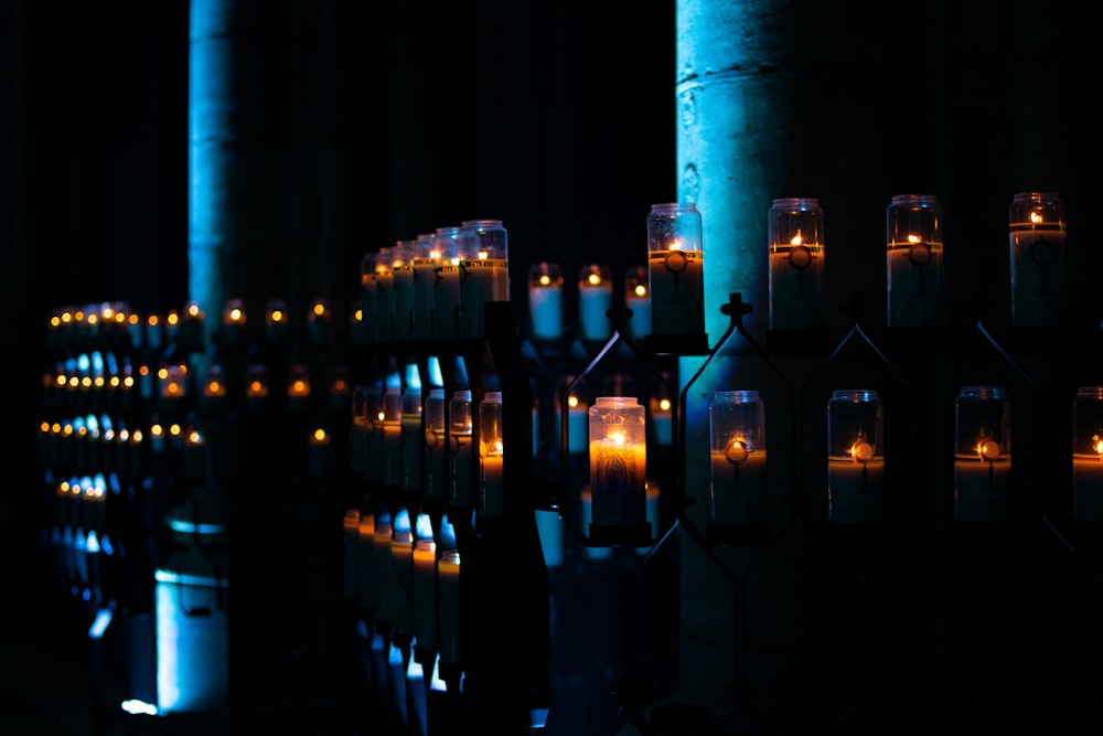 lighted candles on shelves