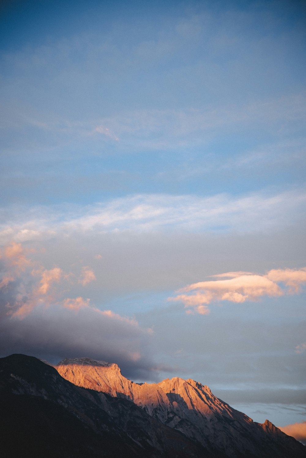 mountains under cloudy sky