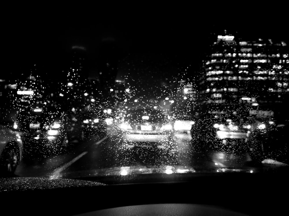 a black and white photo of a city at night