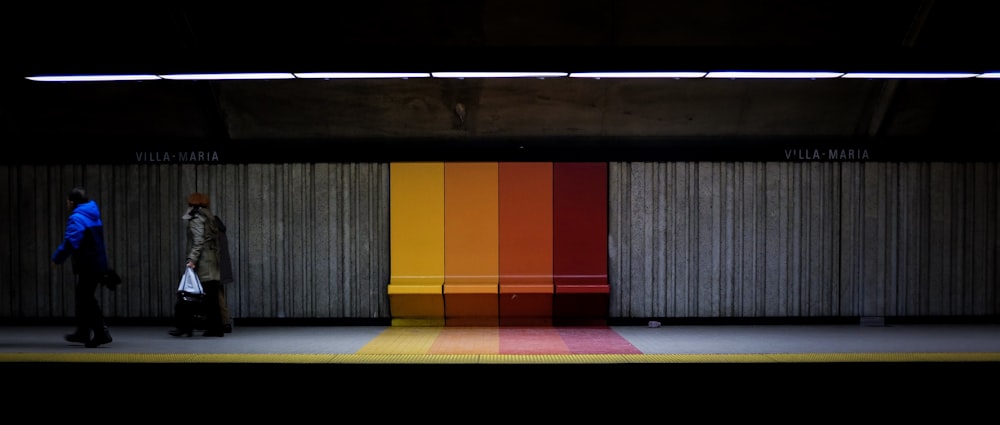 two person at train station during daytime