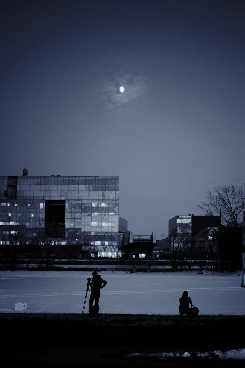 peope near snow field during nighttime