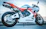 white and orange Honda sportbike