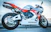 white and orange Honda sportbike
