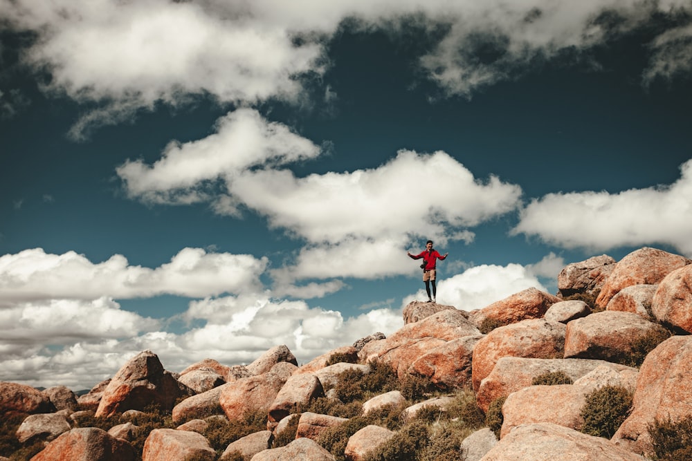 person standing on stones during daytime