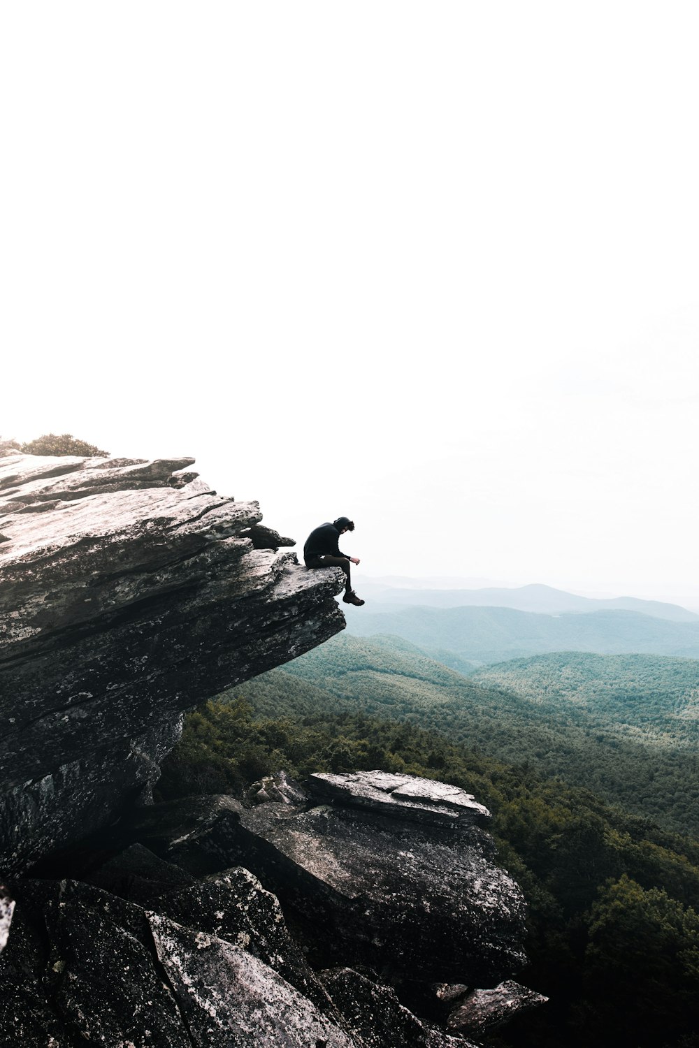 person sitting on rock formations