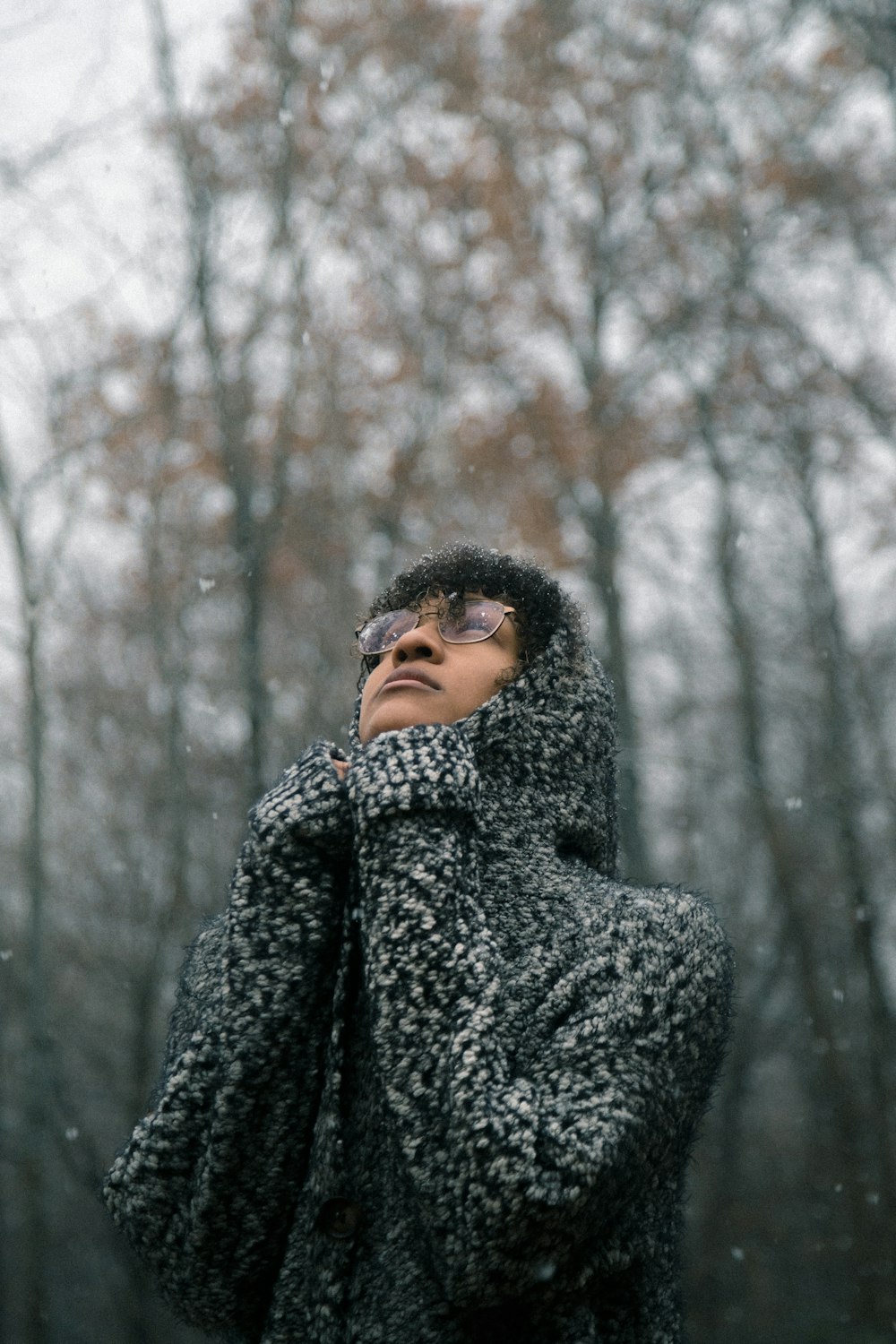 man standing under tree