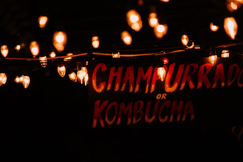 Champurrrado or Kombucha signage with turned-on string lights