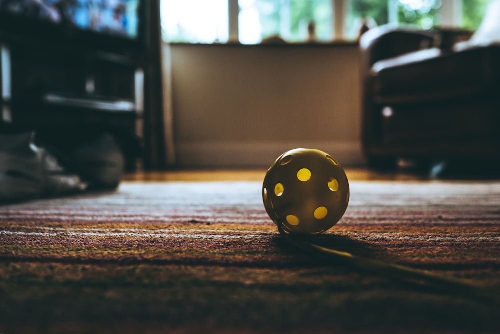 white ball on brown floor