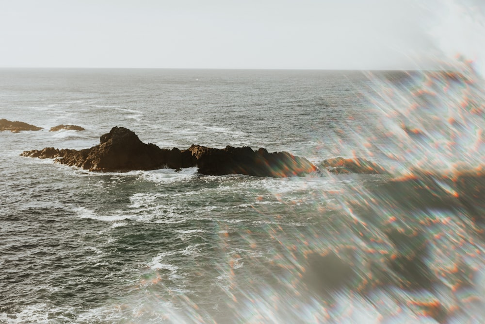 body of water under gray sky