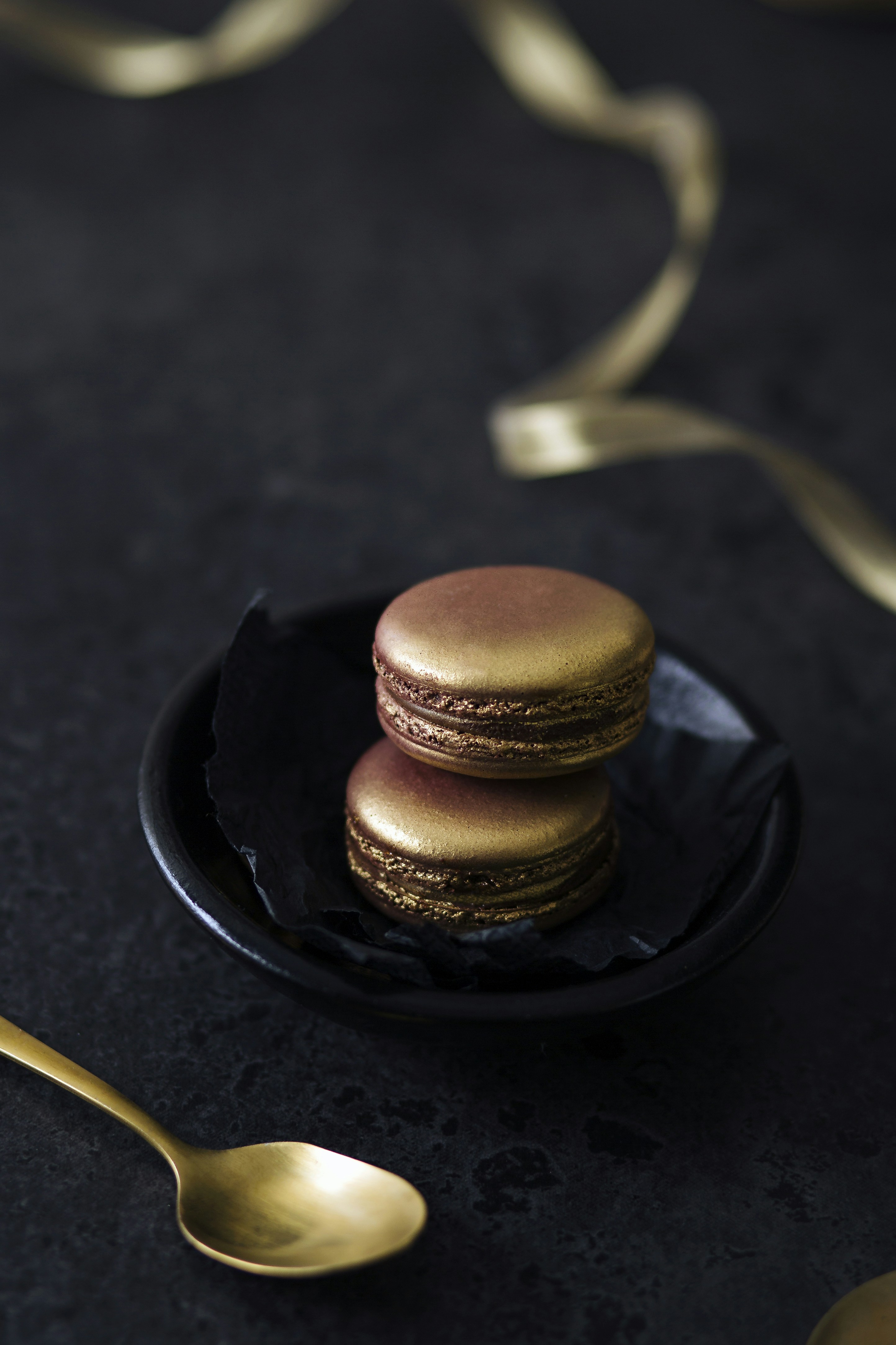I stumbled upon these gold macarons and had to photograph them. Glam food at its finest! Also playing with monochromatic colours.