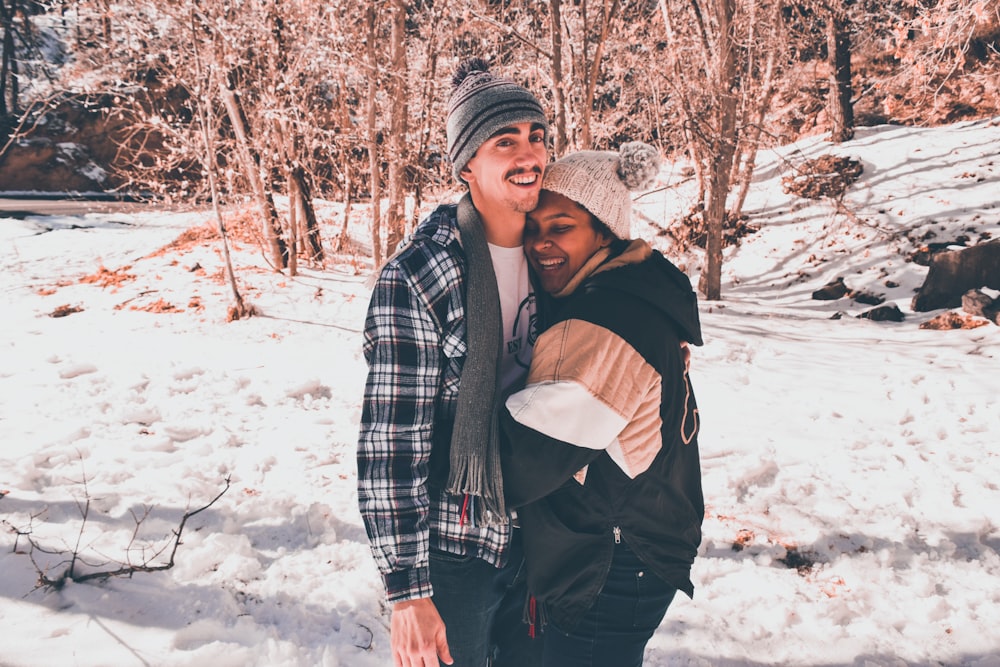 a couple in a snow field