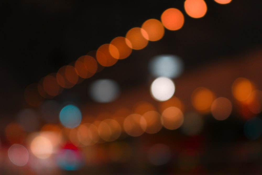 a blurry photo of a city street at night