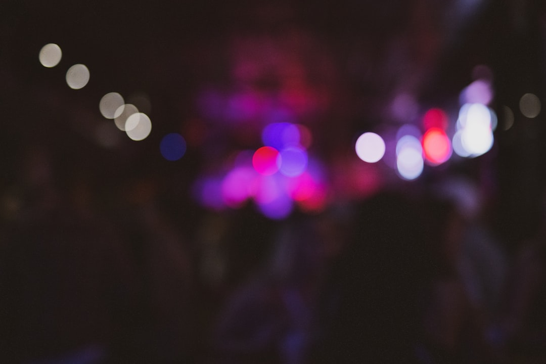 a blurry photo of a city street at night,