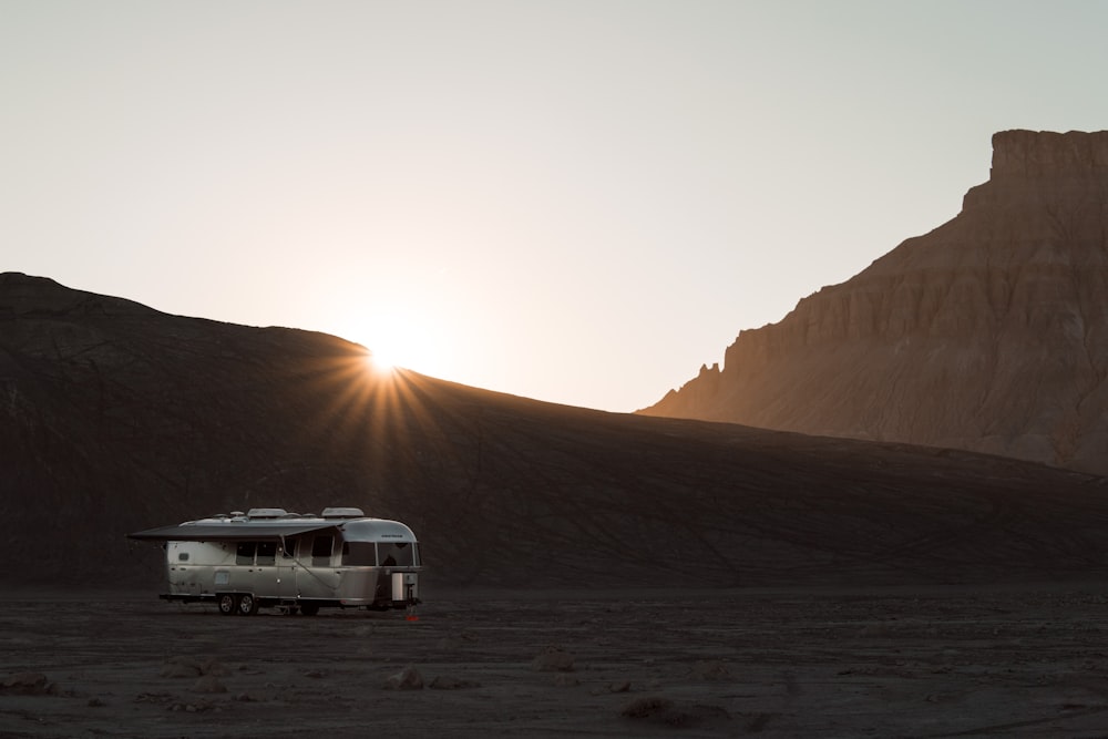 gray camper trailer during golden hour