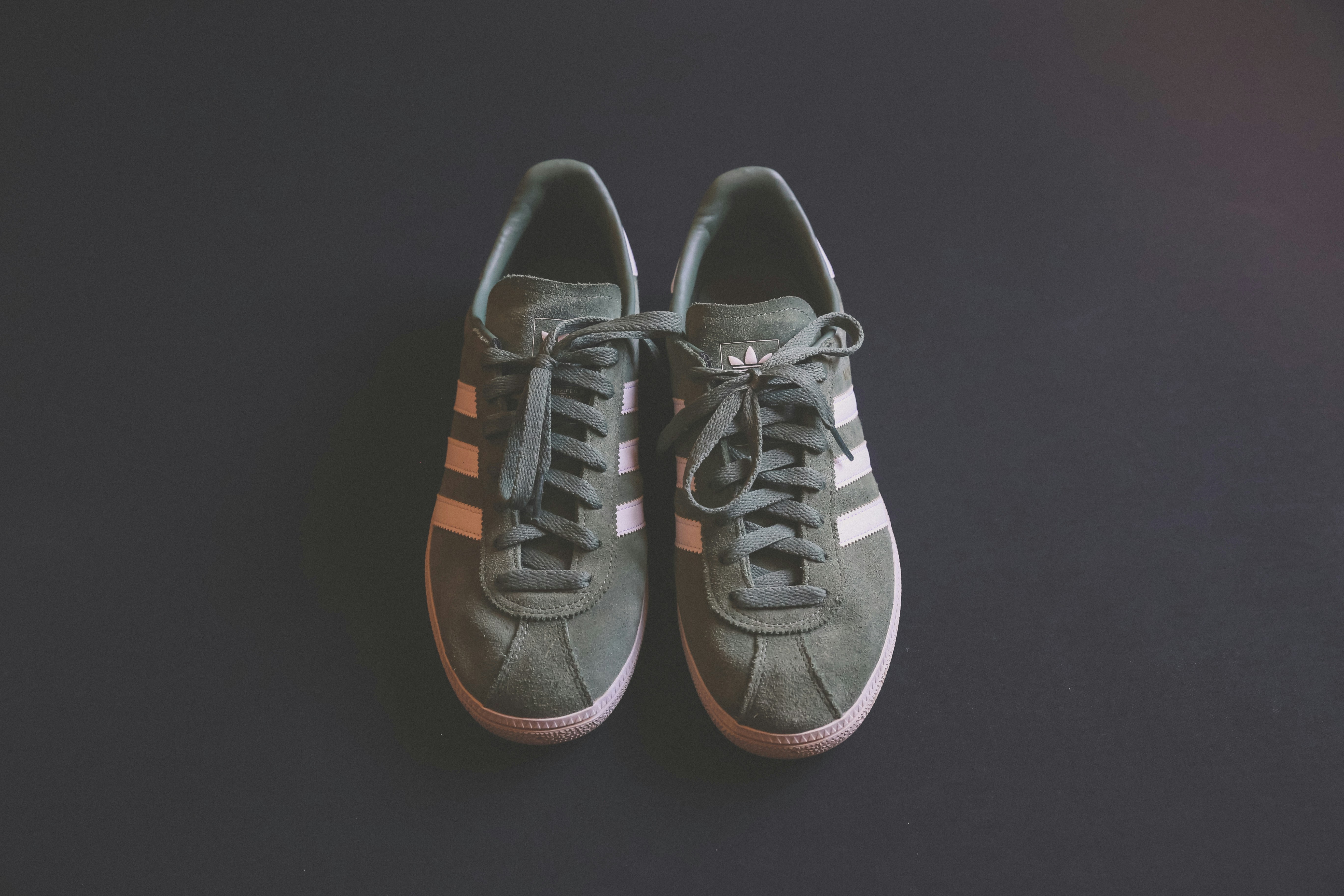 pair of gray adidas shoes