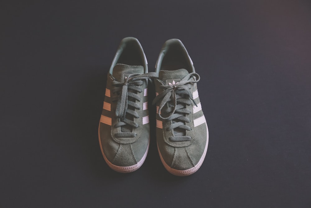 pair of gray adidas shoes