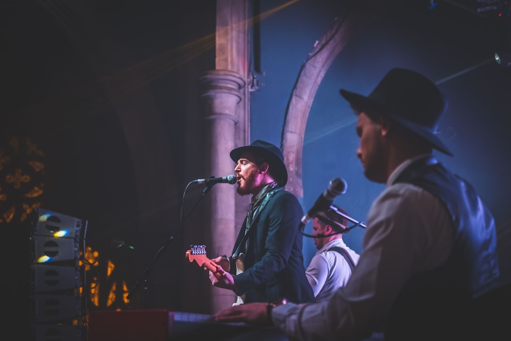 group of band playing during night