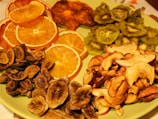 Barbeque flavored banana chips arranged neatly on a wooden platter.