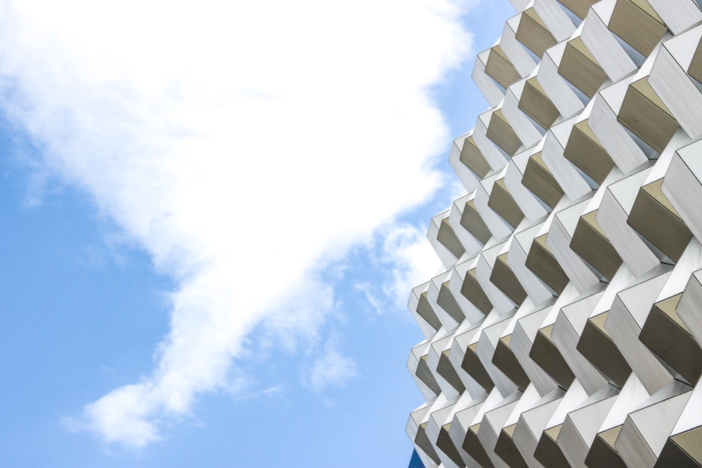 white cloud and white and beige building