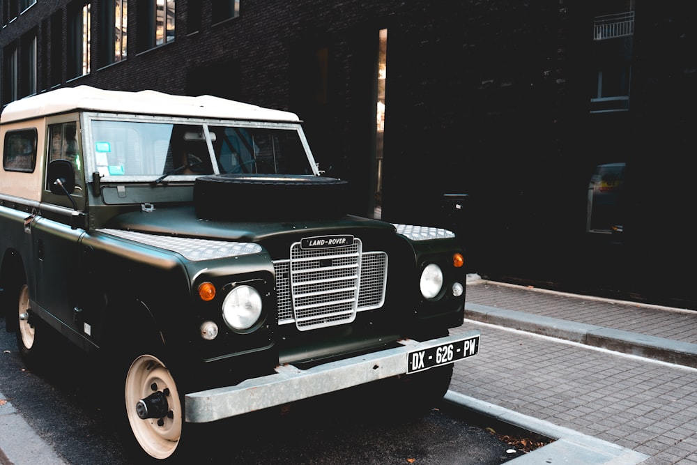 classic black vehicle near on wall