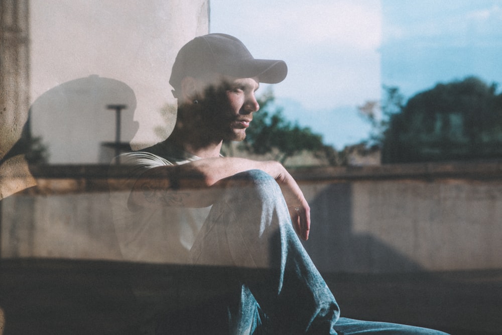 reflection of man on glass window