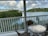 A happy guest enjoying the view from the balcony.
