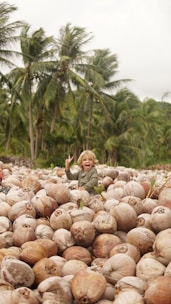 girl sitting on coconut shell