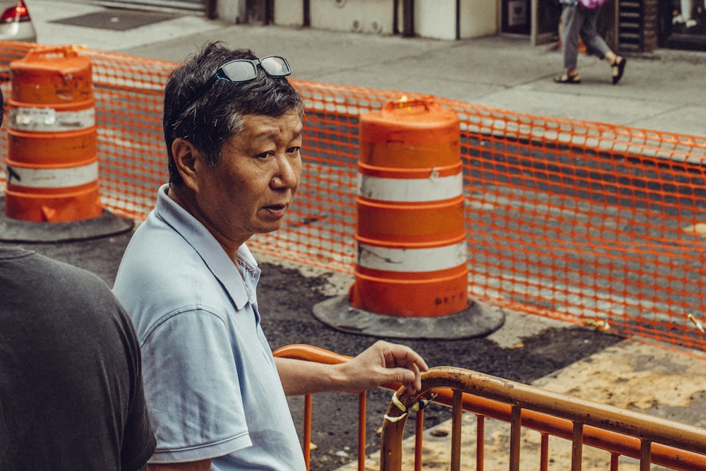 man wearing teal polo shirt