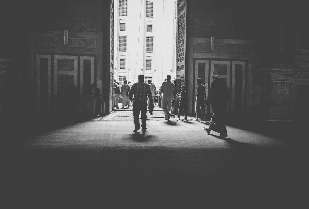 grayscale photo of people walking on street