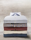 A collection of custom shirts folded neatly.