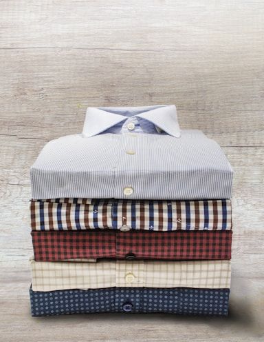 A casual arrangement of men's shirts and pants.
