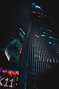 low-angle photography of black high-rise building