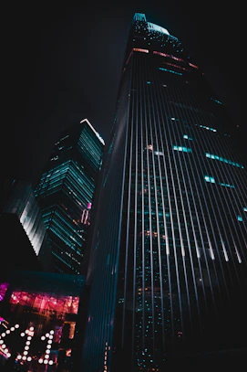 low-angle photography of black high-rise building