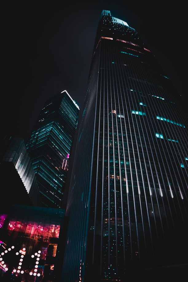 low-angle photography of black high-rise building