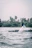 Man casting a fishing line from a modern boat surrounded by lush greenery.