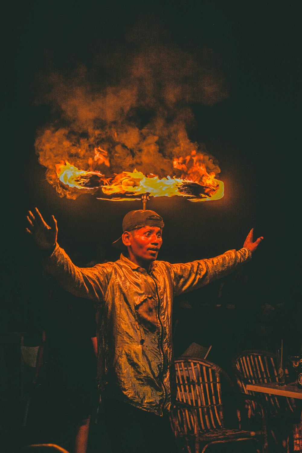 man balancing fire on head