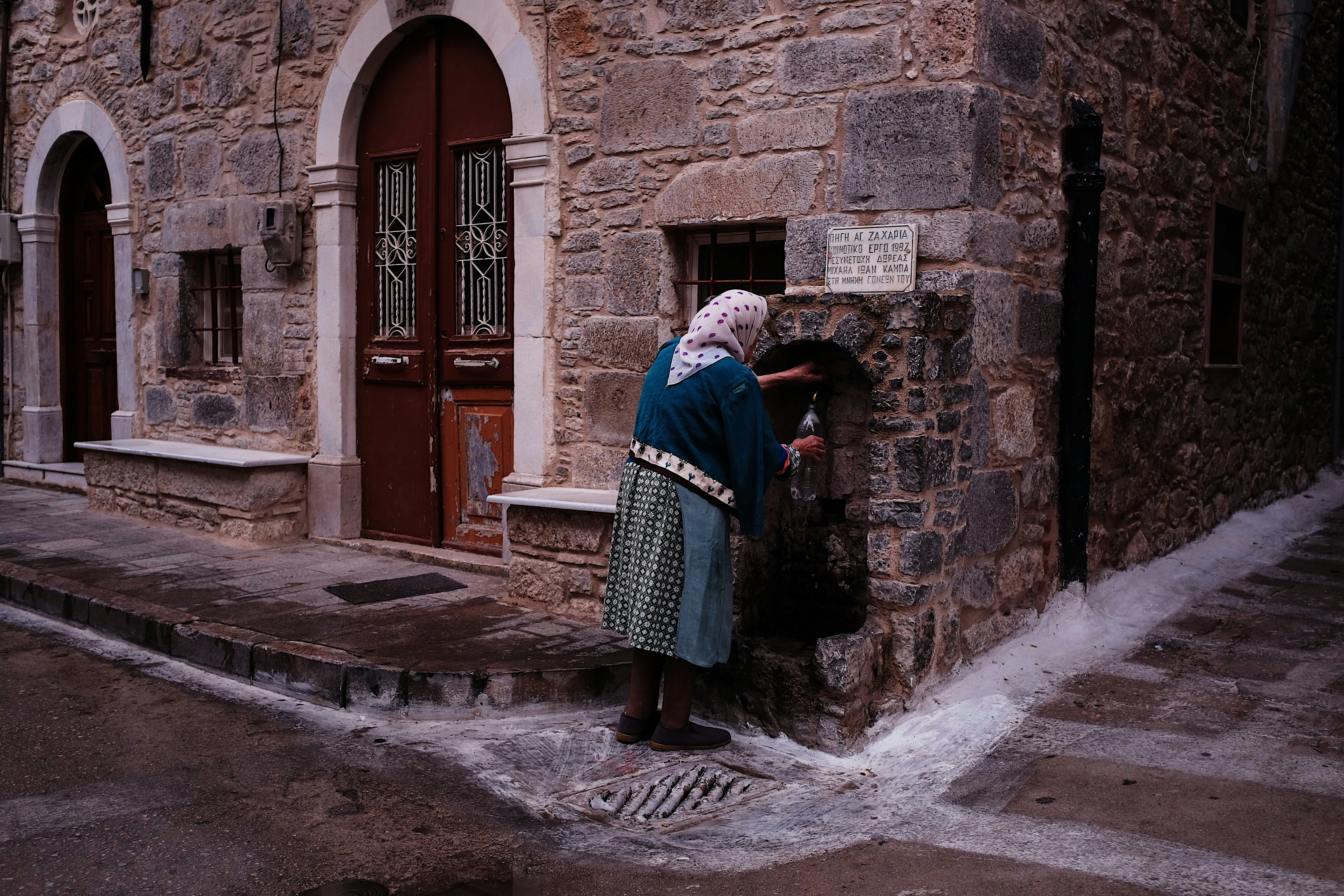woman standing beside wall