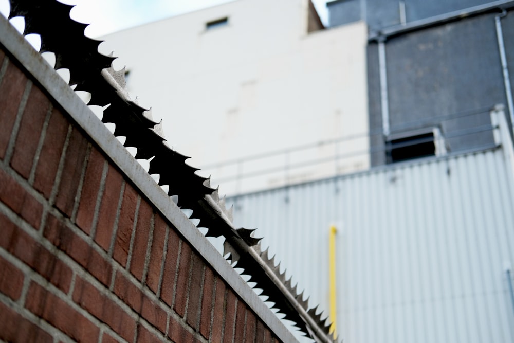 a close up of a brick wall near a building