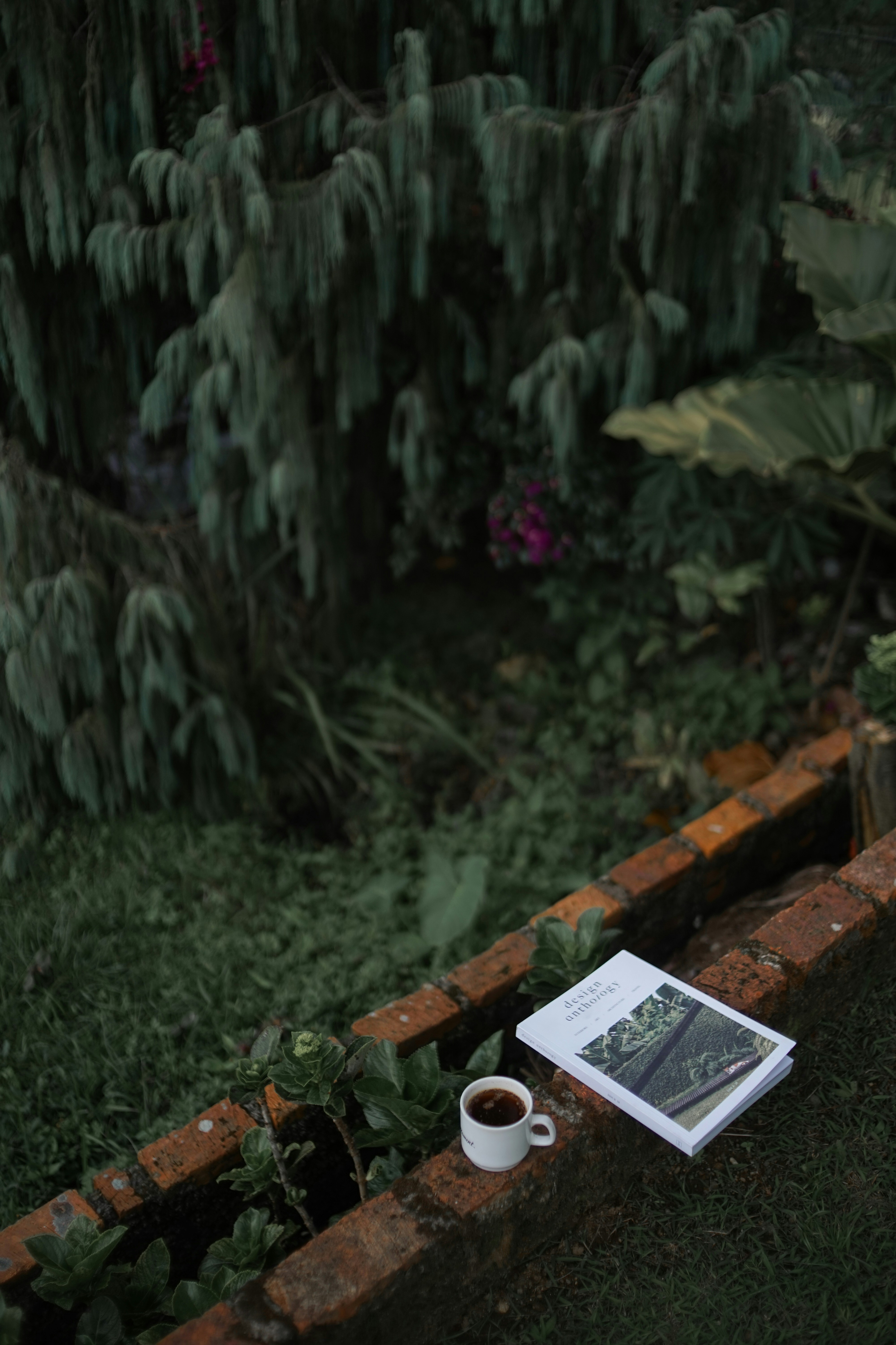 white mug beside book