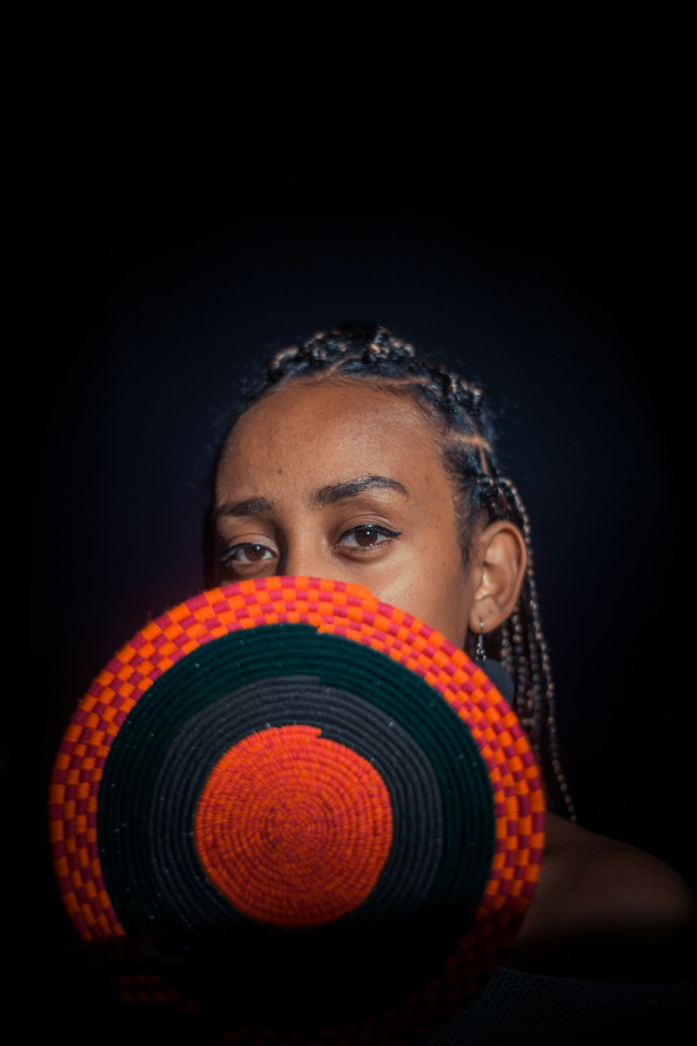 woman covering her face using mat